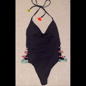 Black one piece w/ tribal colored detail on sides